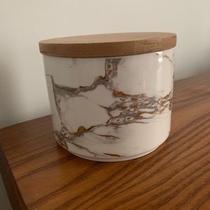 HomeGoods: white marble container with wooden lid
